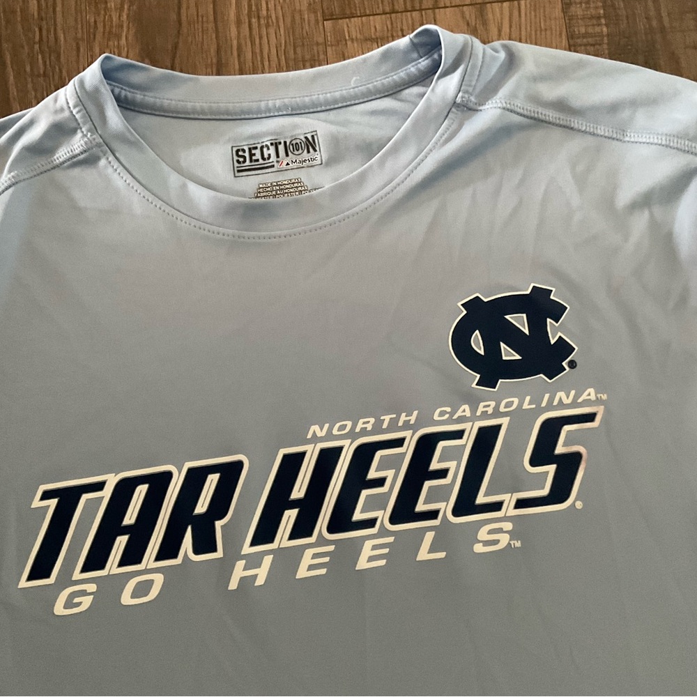 Brand new TAR HEELS, large, polyester short sleeve shirt